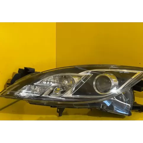 14079 фара передняя Mazda 626 2013