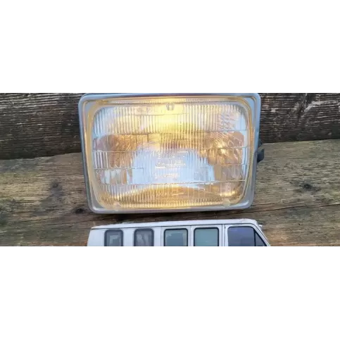 E77B11654AA фара передняя Ford Econovan 1988