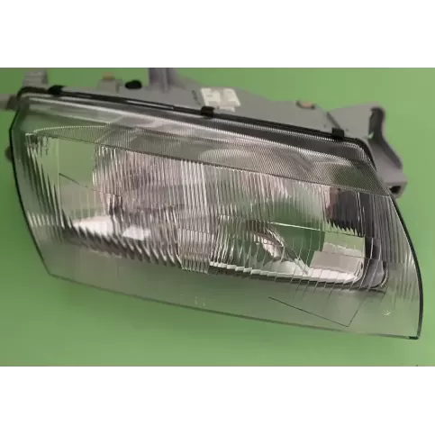 BG2L51030C фара передня Mazda 323 1997
