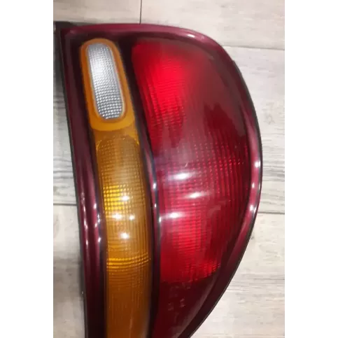527108 фара задня Chrysler Stratus 1998